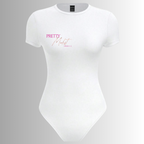 White bodysuit with pink text on a gray background